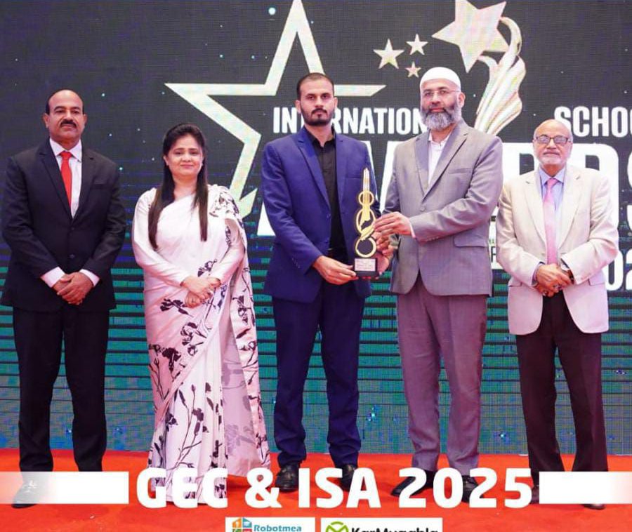 Muhammad Waqas receiving international award with team for NLP coaching and personal development training programs